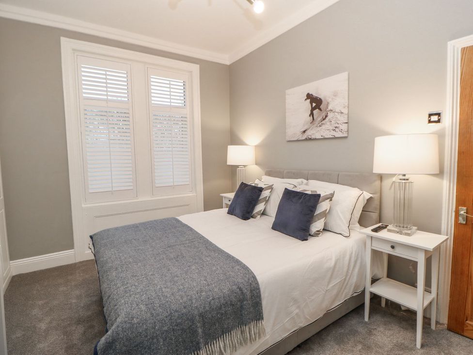 A bedroom with a bed and bedside tables at 16 Seafield Terrace South Shields