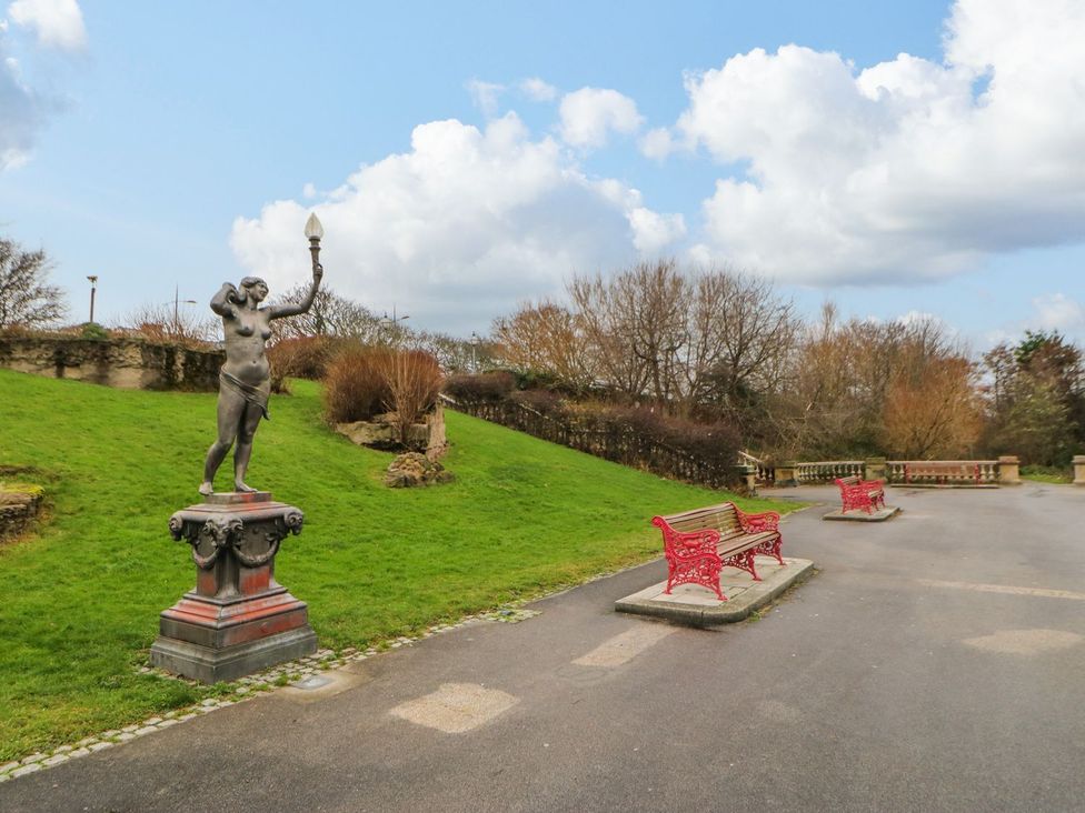 A park featuring a statue and benches at 16 Seafield Terrace South Shields