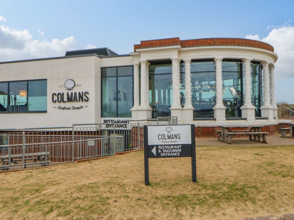 A seafood restaurant exterior with a sign at Colmans Seafood Temple in South Shields