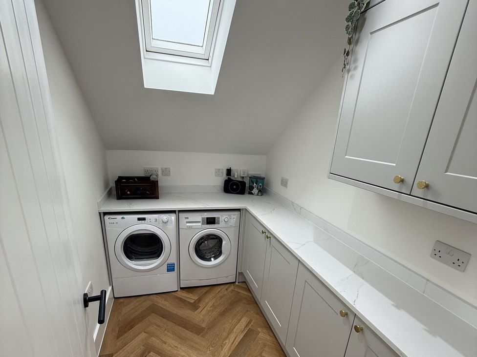 A laundry room with a washing machine and a dryer at Bader House Ipswich