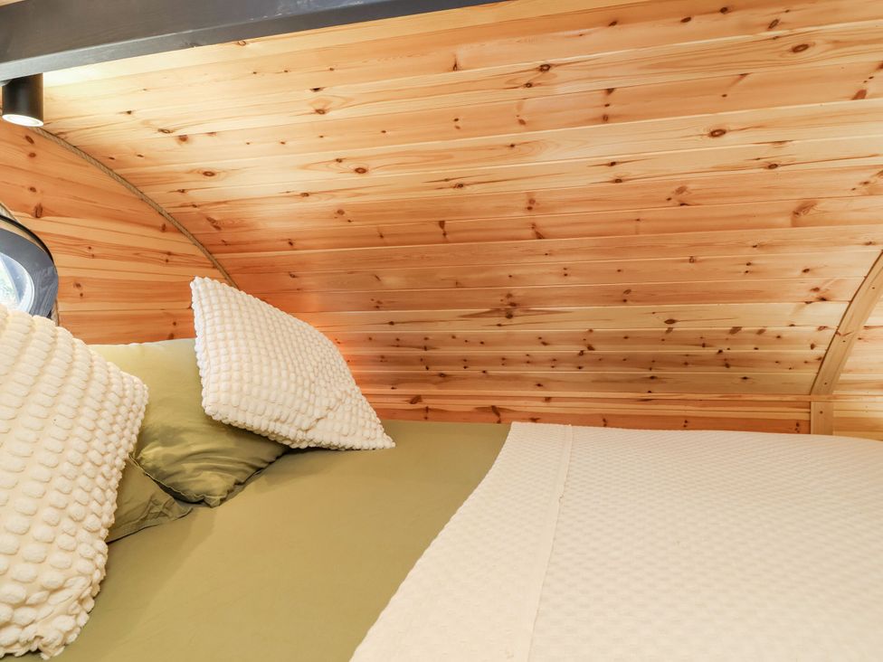 A bedroom with a wooden ceiling and bed at Bugley Pools Hideaway Bugley near Gillingham