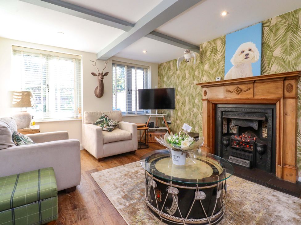 A living room with a sofa and coffee table at Cottage