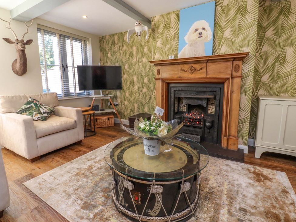 A living room with a sofa and a coffee table at Cottage in 