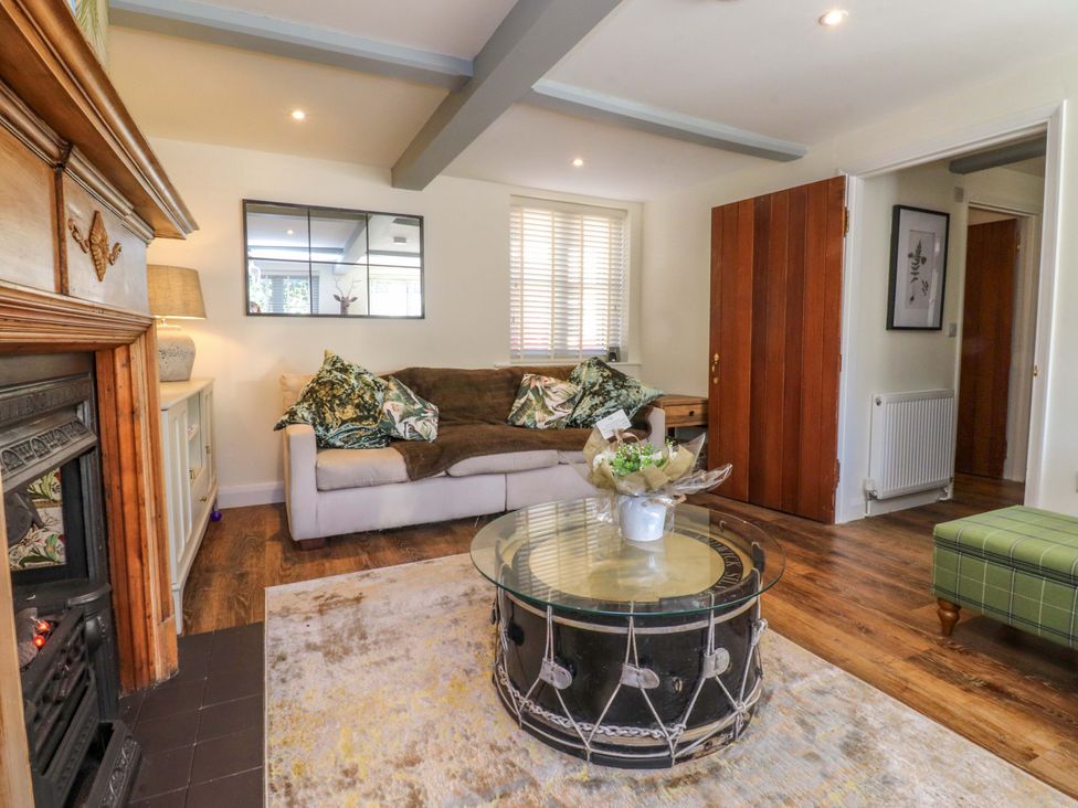 A living room with a sofa and coffee table at Cottage