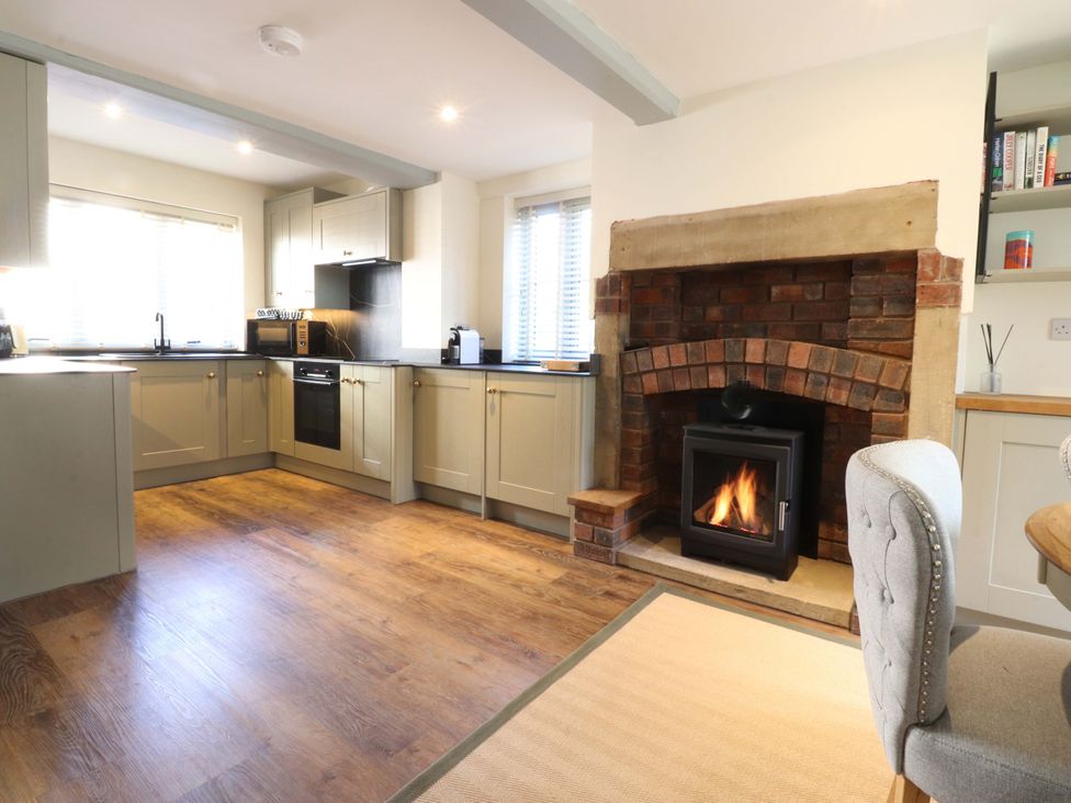 A kitchen with a stove and oven in the Cottage