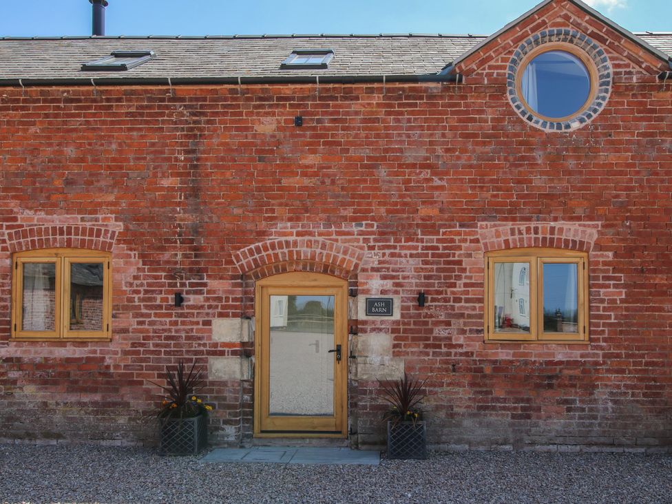 An entrance with windows and a door at Ash Barn in Shrewsbury