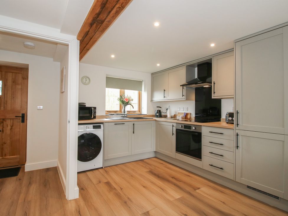 A kitchen with appliances and cabinets at Ash Barn in Northwood near Wem