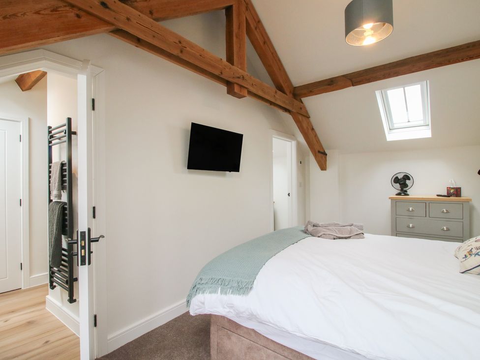 A bedroom with a bed and a dresser at Ash Barn Northwood near Wem