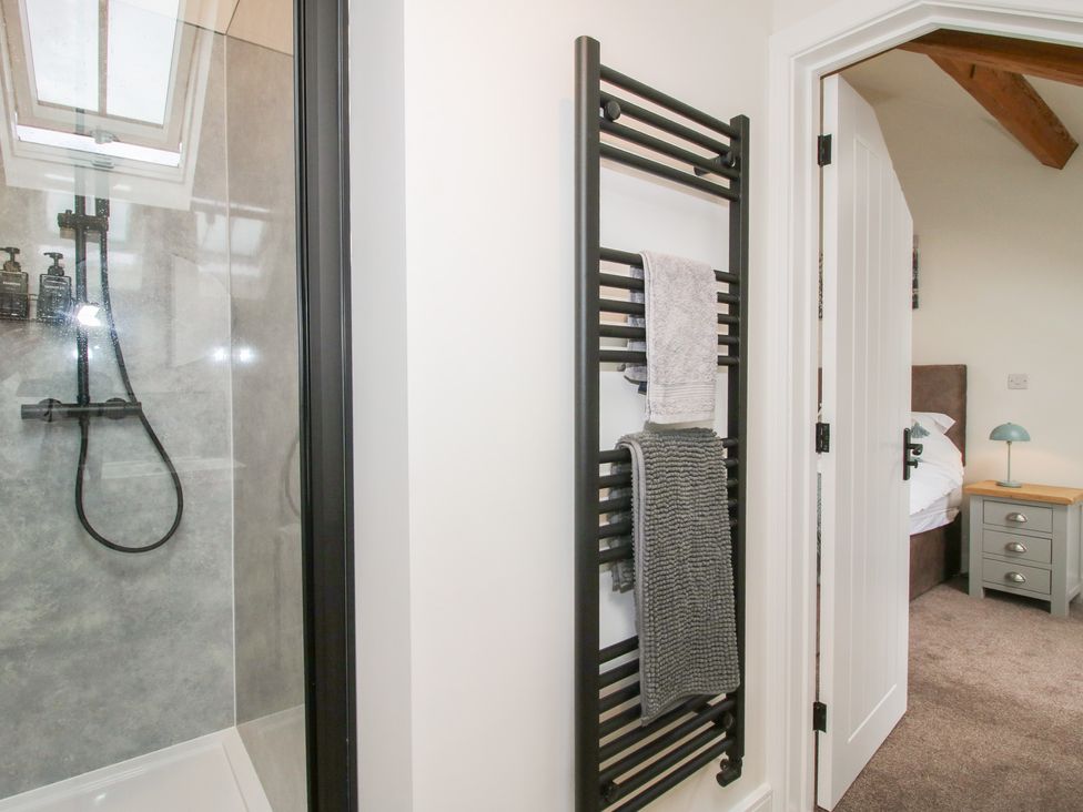 A bathroom with a shower and a towel radiator at Ash Barn in Northwood near Wem