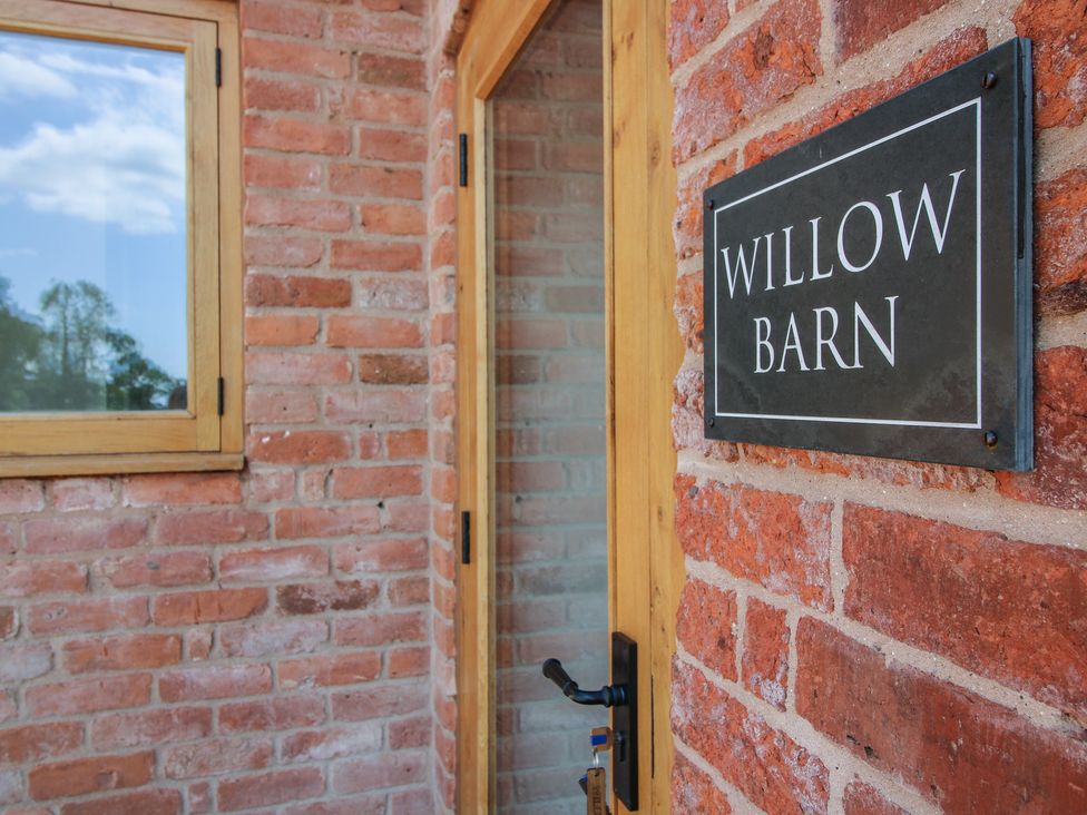 An entrance with a door and window at Willow Barn in Shrewsbury