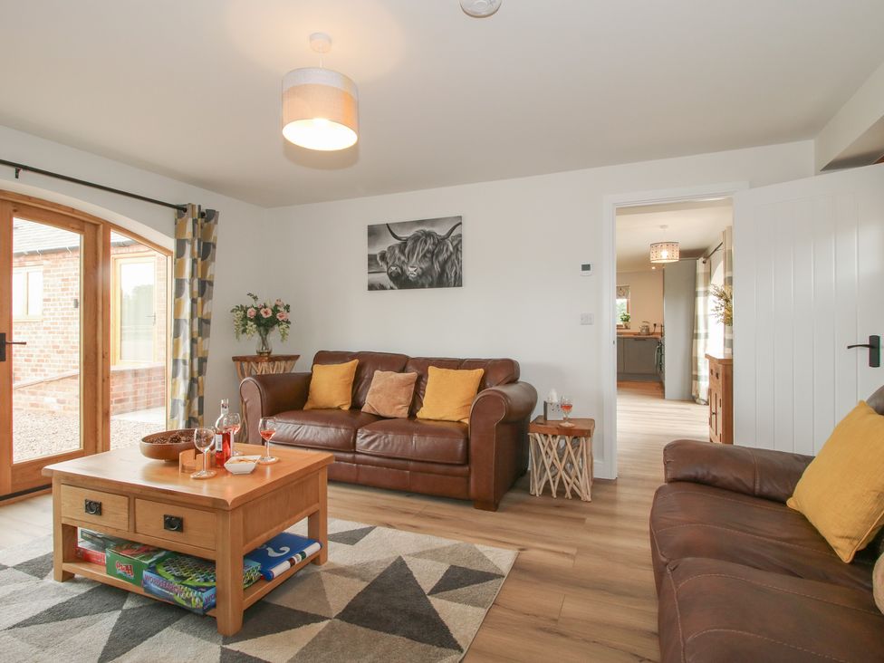 A living room with a sofa and coffee table at Willow Barn Northwood near Wem