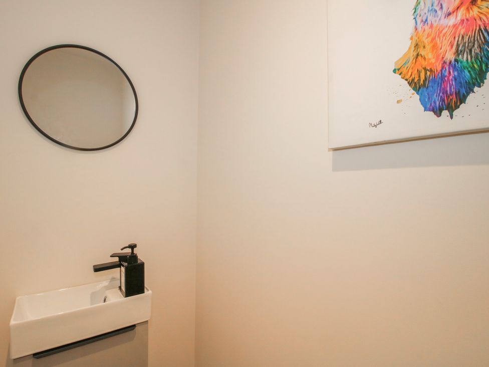 A bathroom with a sink and mirror at Willow Barn Northwood near Wem