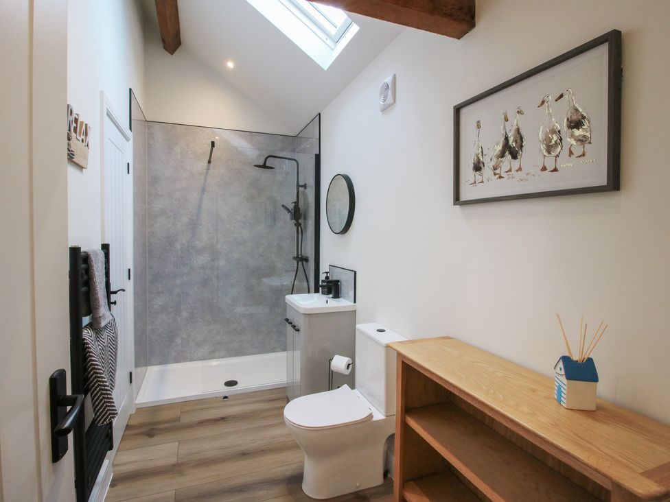 A bathroom with a shower and toilet at Elm Barn Northwood near Wem