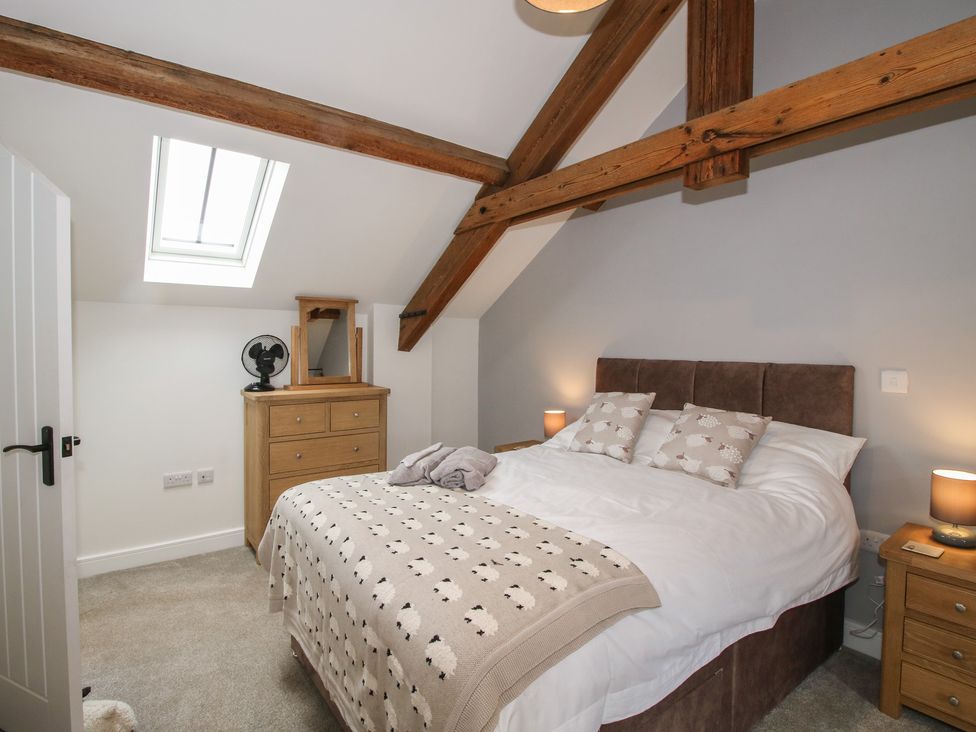 A bedroom with a bed and chest of drawers at Elm Barn Northwood near Wem