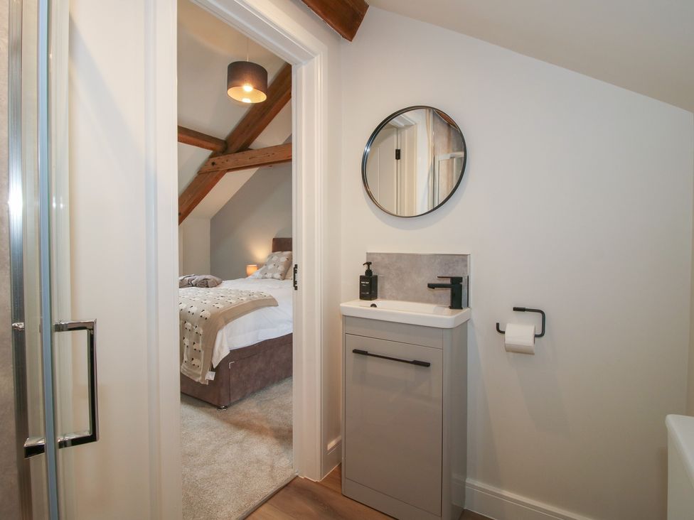 A bathroom with shower and sink at Elm Barn Northwood near Wem
