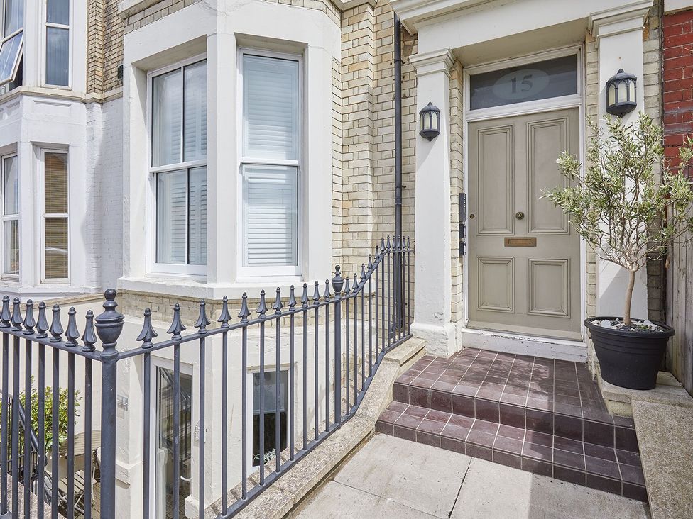 An entrance with a front door and gate at Apartment 2 in Whitby