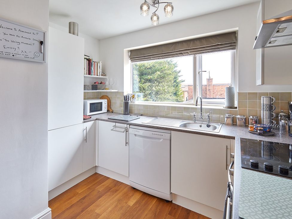 A kitchen with sink and dishwasher at Apartment 2 in Whitby