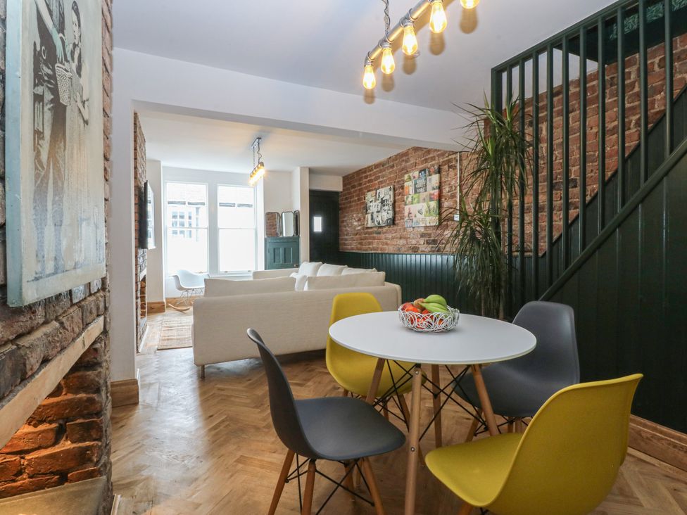 A dining area with a table and chairs at 5 Llewelyn Street Conwy