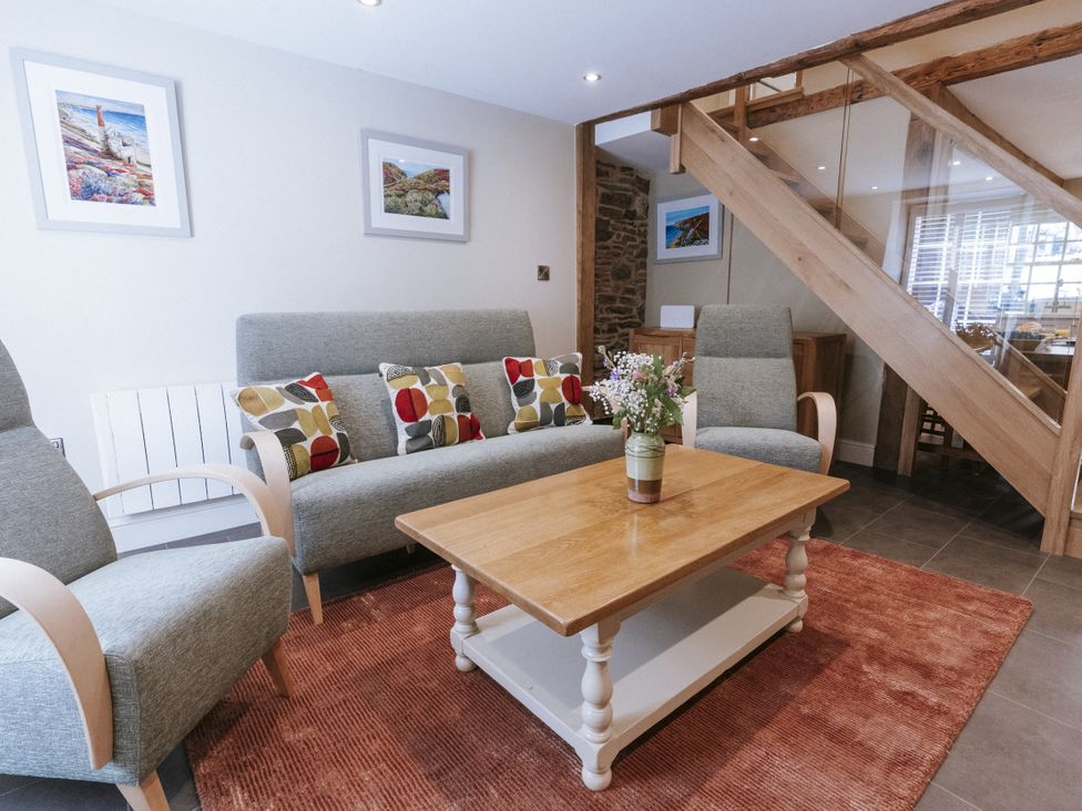 A living room with sofa and coffee table at Bluck's cottage in St. Agnes