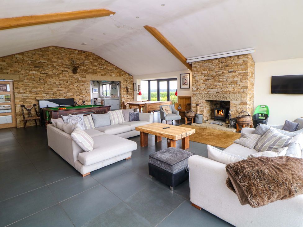 A living room with sofas and a fireplace at Highgate house