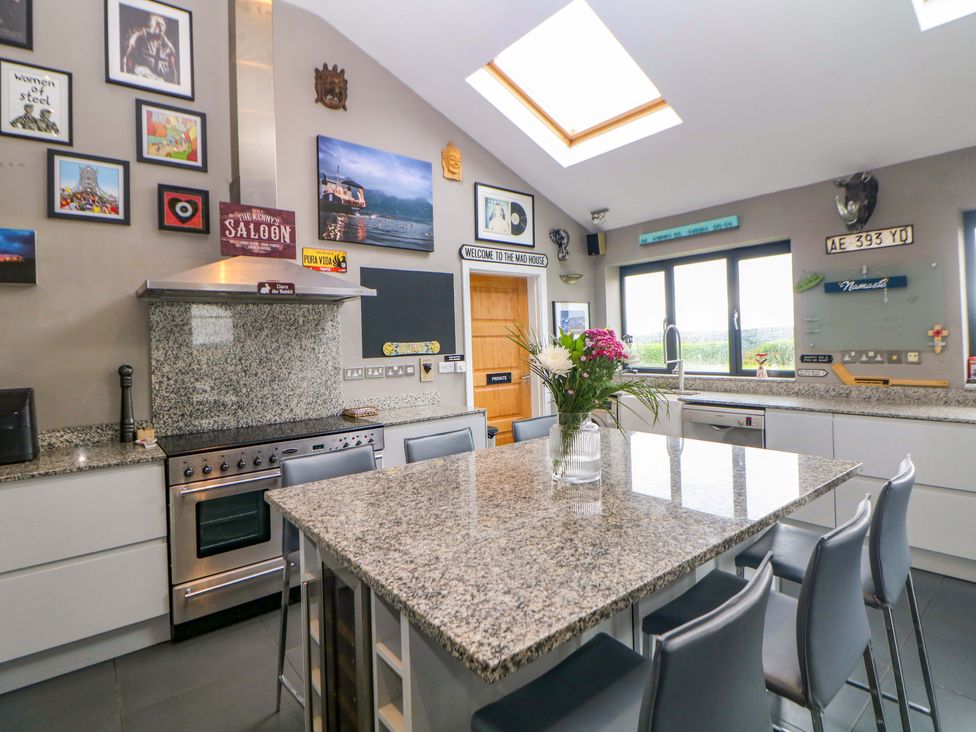 A kitchen with countertops and appliances at Highgate house