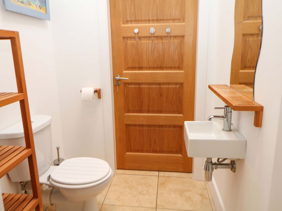 A bathroom with a toilet and sink at Highgate house