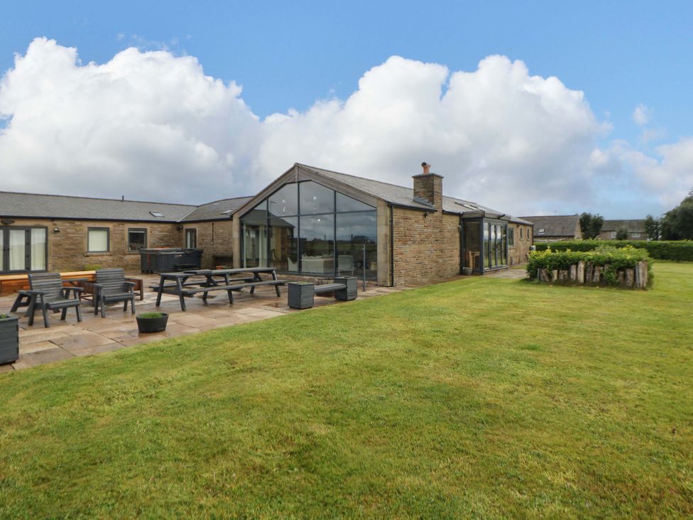 An outdoor area with seating and landscaping at Highgate house 