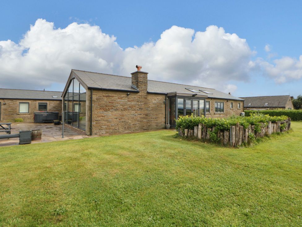 An outdoor view of a brick building with glass walls at Highgate house
