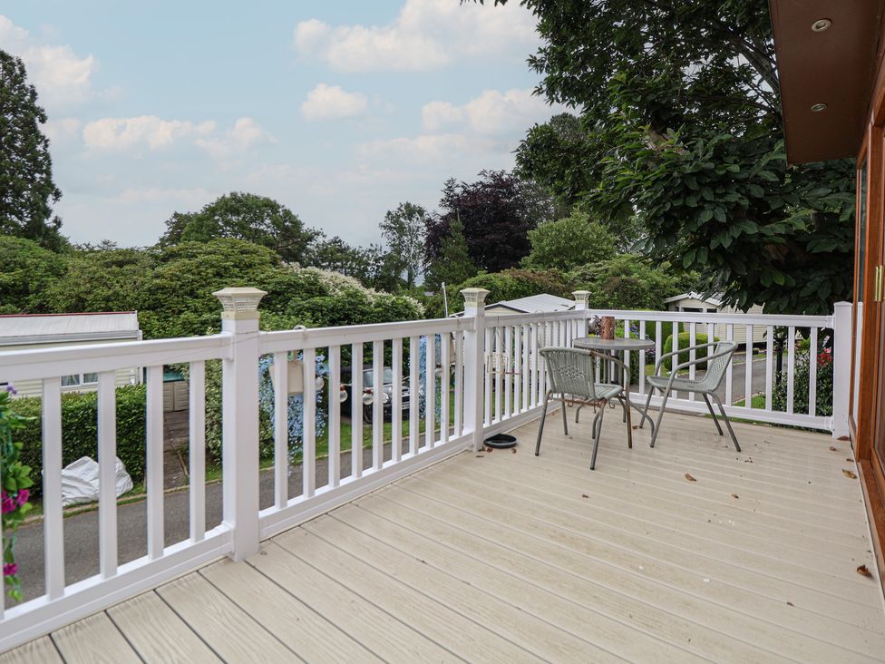 A deck with a table and chairs at 96 Ruthin