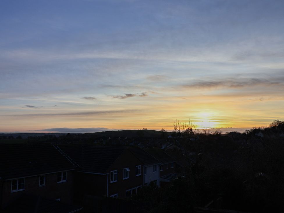 A view of houses and a sunset in Paignton