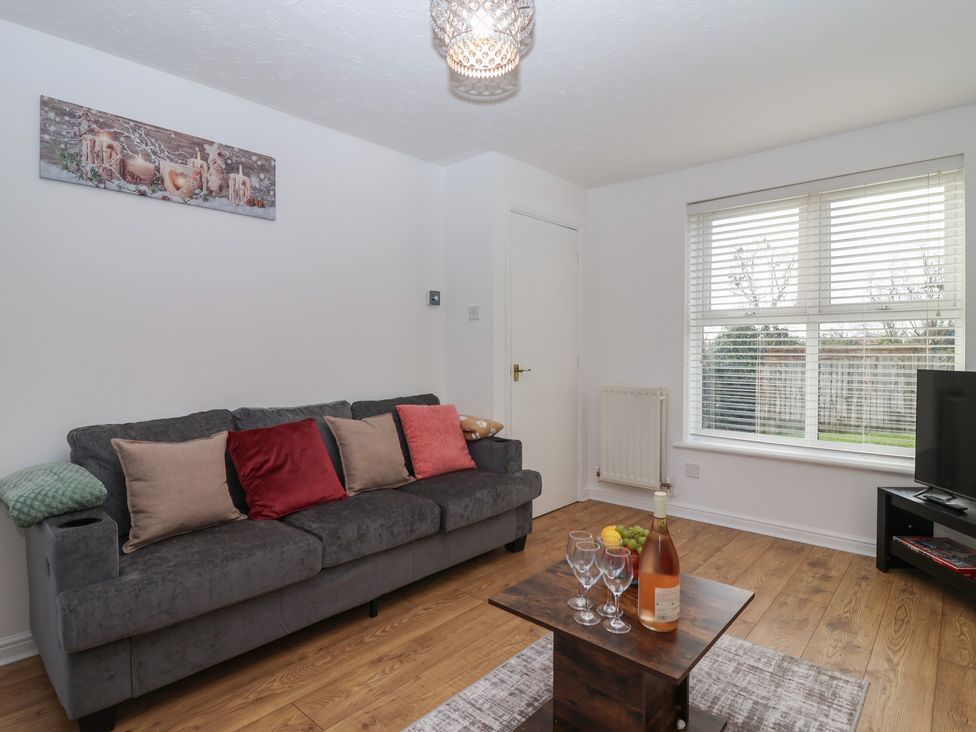 A living room with a sofa and coffee table at The Cosy View in Paignton