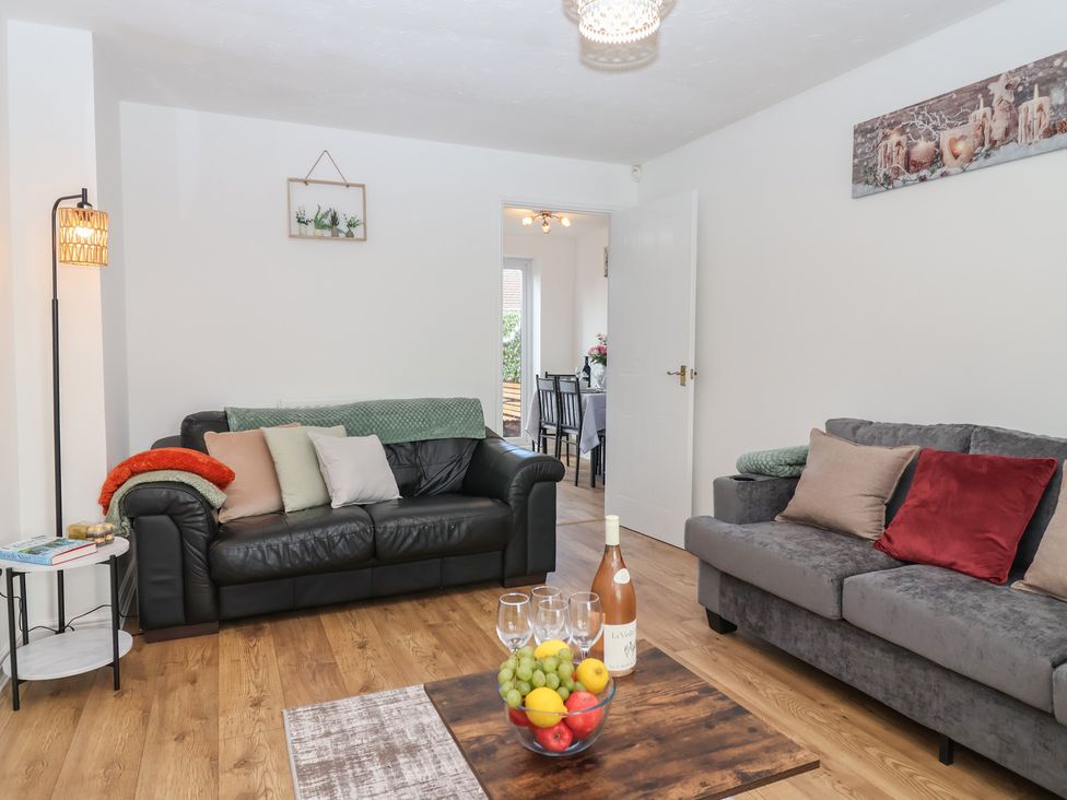 A living room with sofas and a coffee table at The Cosy View in Paignton