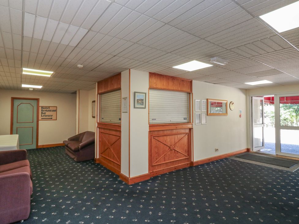 A lobby area with reception desk and seating at Avocet Newton Abbot