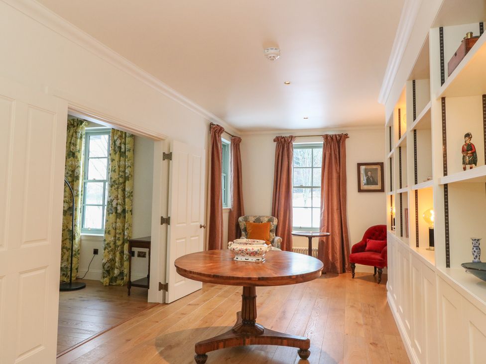 A snug with a table and chairs at Schiehallion House Pitlochry