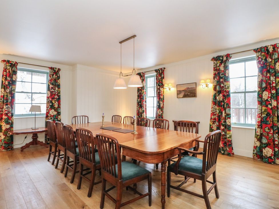 A dining room with a table and chairs at Schiehallion House in Pitlochry
