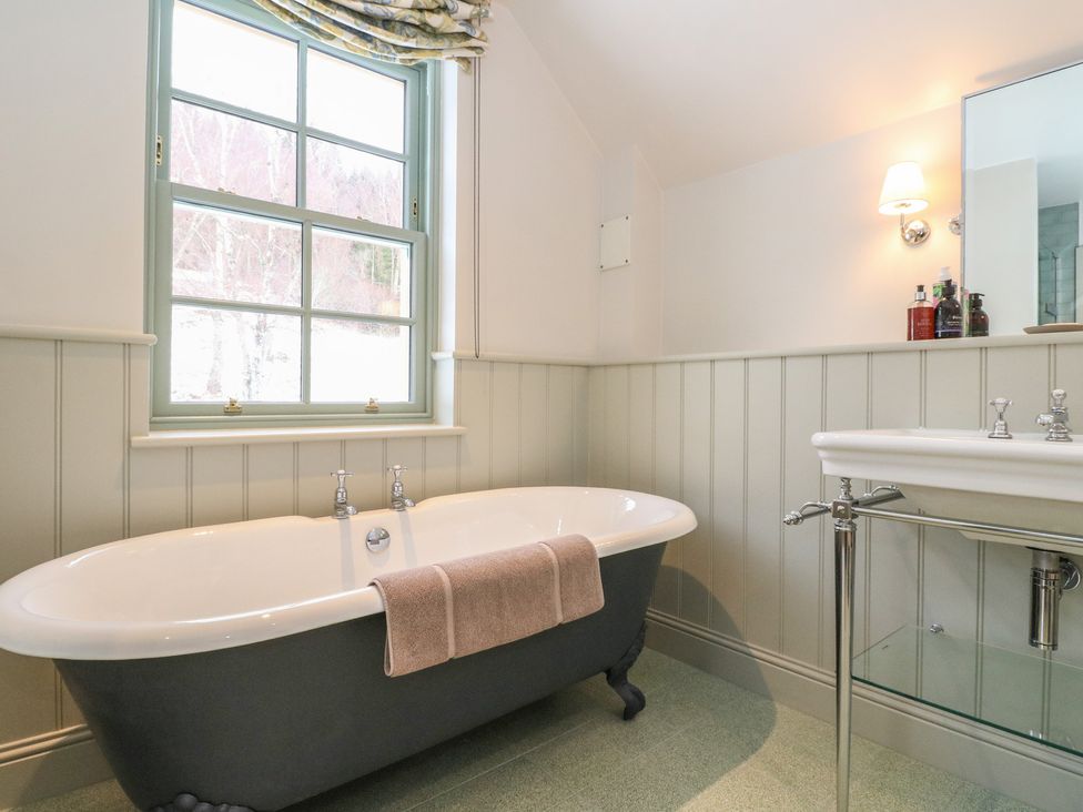 A bathroom featuring a bathtub and a sink at Schiehallion House in Pitlochry