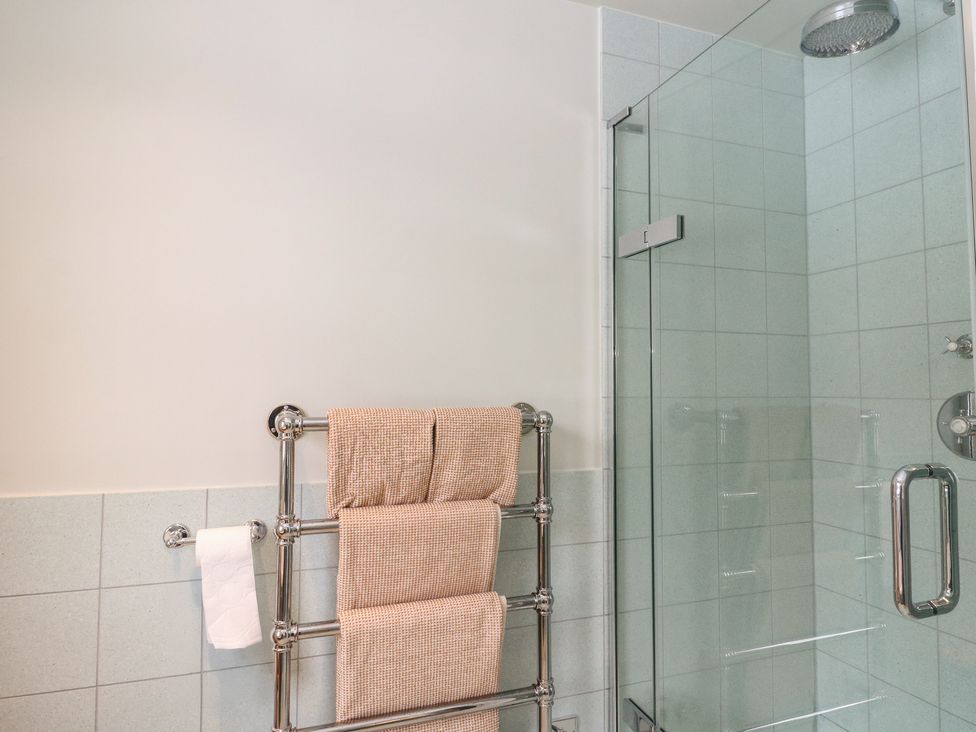 A bathroom with a towel rail and shower at Schiehallion House in Pitlochry