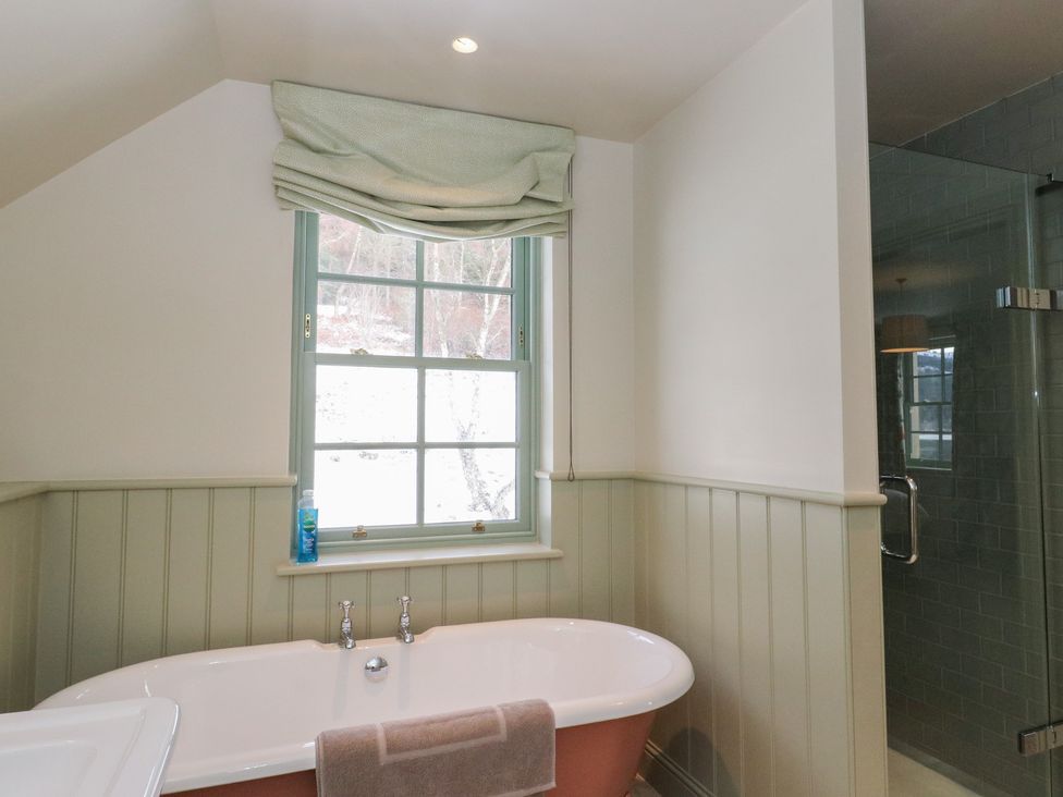 A bathroom featuring a bathtub and a shower at Schiehallion House in Pitlochry