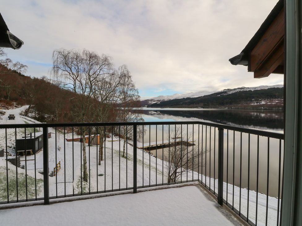 A view of water and snow from a deck at Schiehallion House in Pitlochry