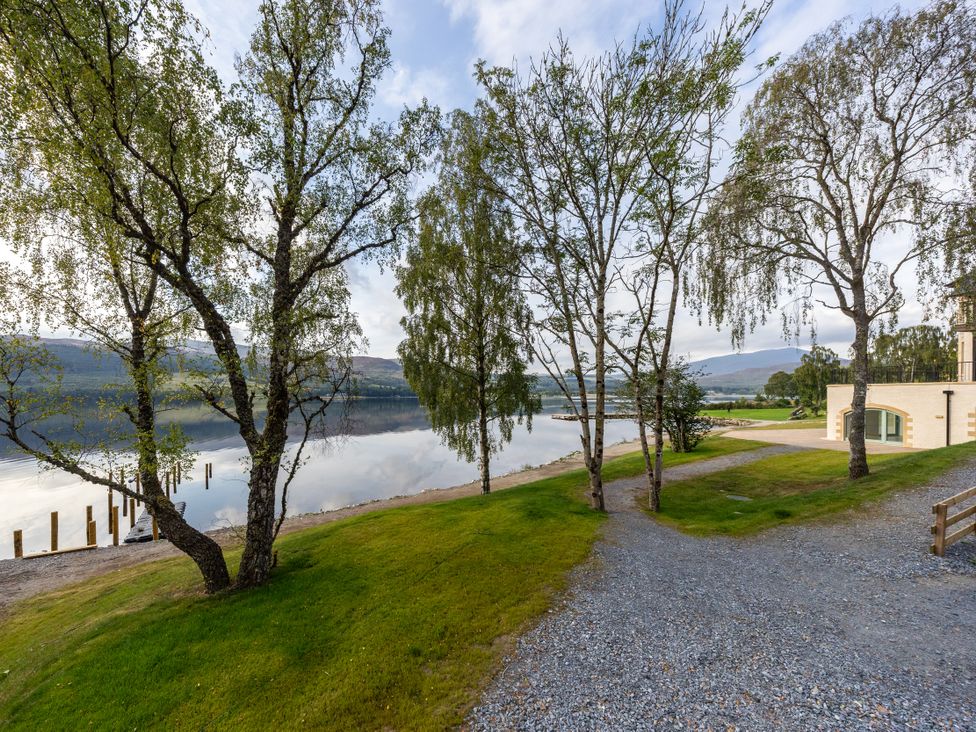 A view of trees and lake at Schiehallion House in Pitlochry