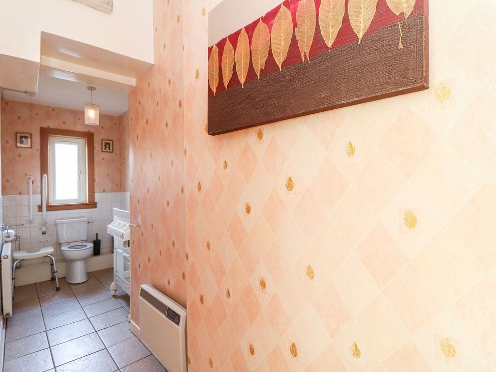A bathroom with a toilet and sink at Seaview Wellness Retreat in Carnoustie