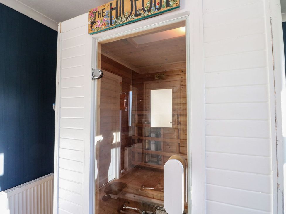 A sauna entrance with wooden interior at Seaview Wellness Retreat in Carnoustie