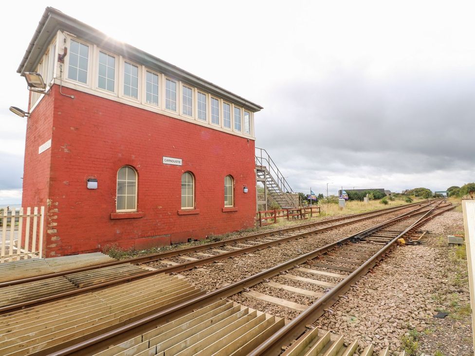 A signal box next to railroad tracks at Seaview Wellness Retreat in Carnoustie