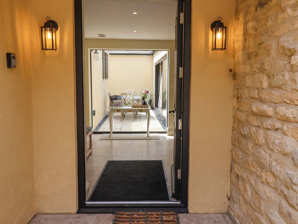 An entrance with a view of a table and chairs at The Annex in Burford