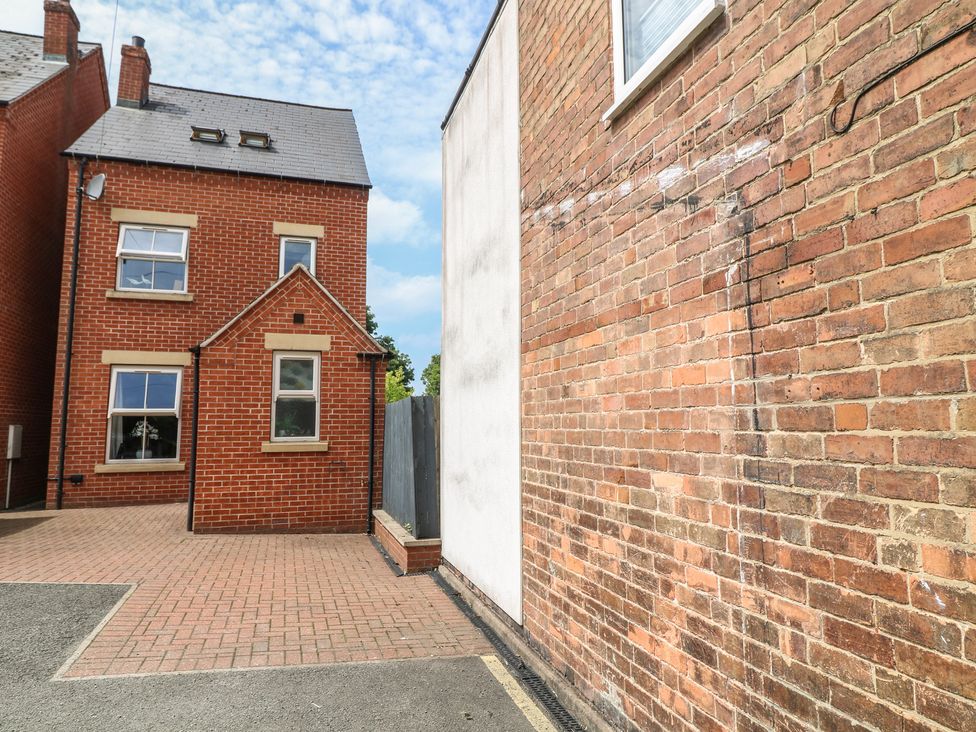 A view of houses and brick walls in an outdoor area at No 39 Ashbourne