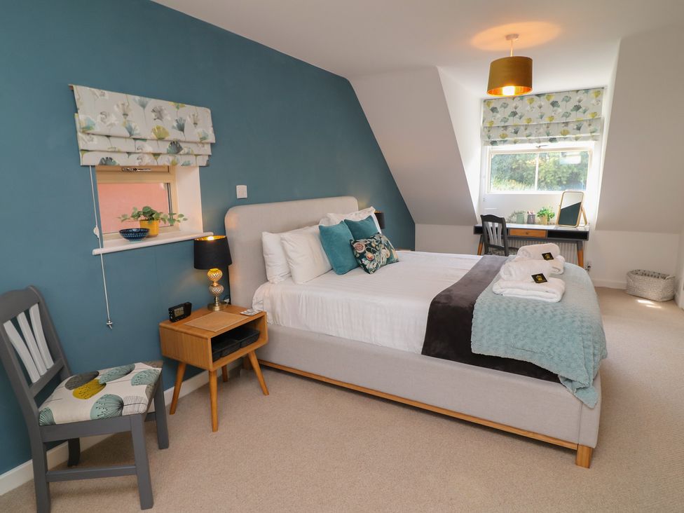A bedroom with a bed and desk at No 39 Ashbourne