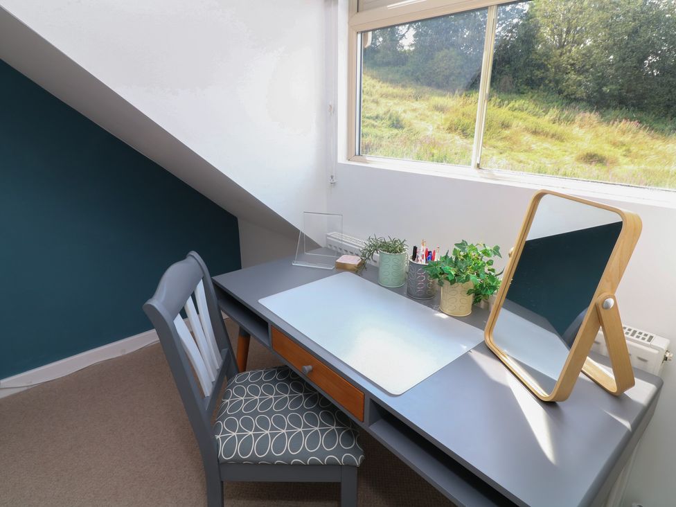 An office with a desk and mirror by a window at No 39 Ashbourne