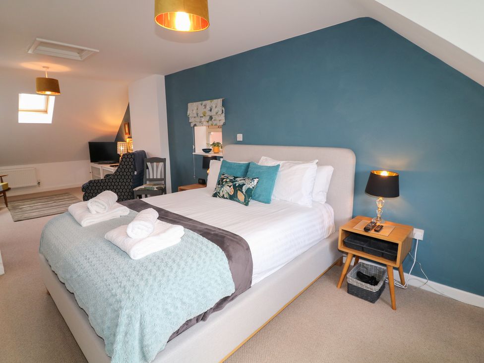 A bedroom with a bed and a television at No 39 Ashbourne