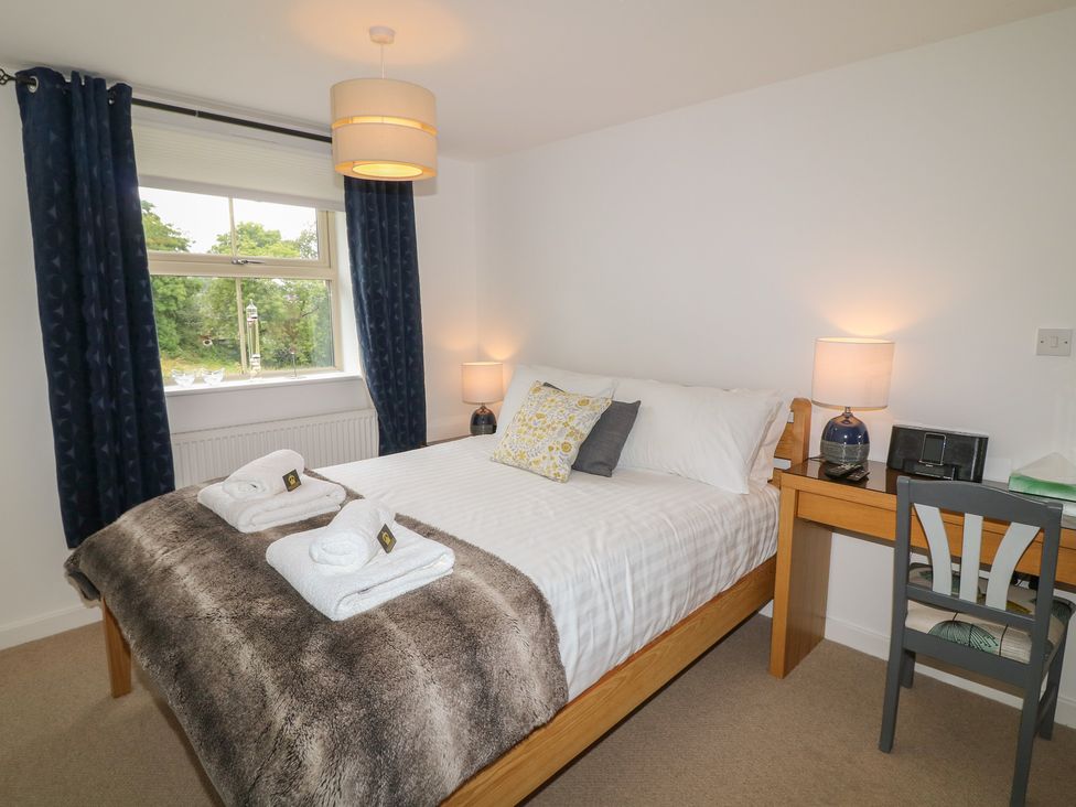 A bedroom with a bed and nightstand at No 39 Ashbourne