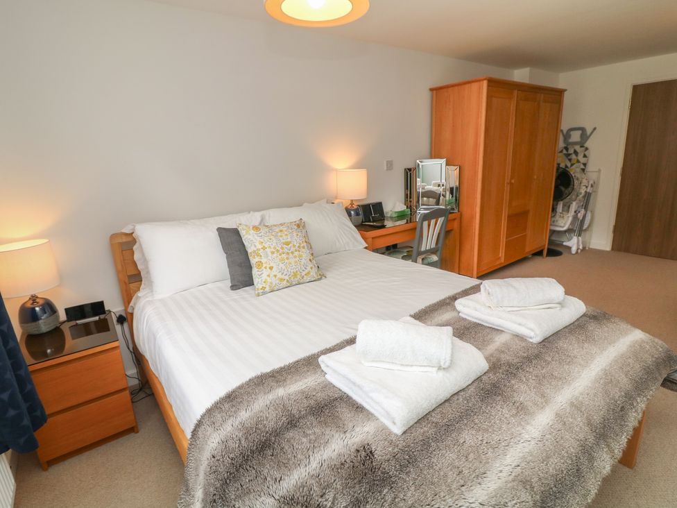 A bedroom with a bed and nightstand at No 39 in Ashbourne